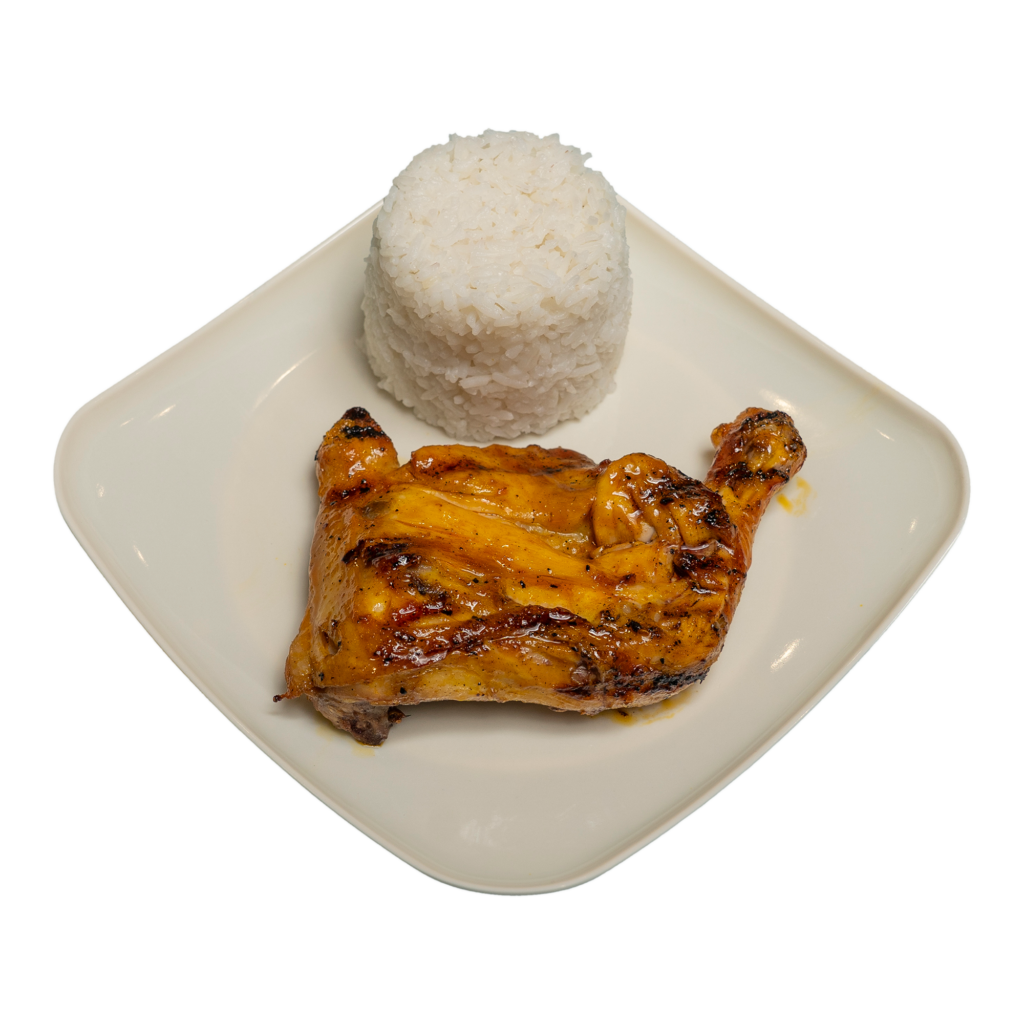 A piece of paa chicken inasal and a cup of rice on a white plate.