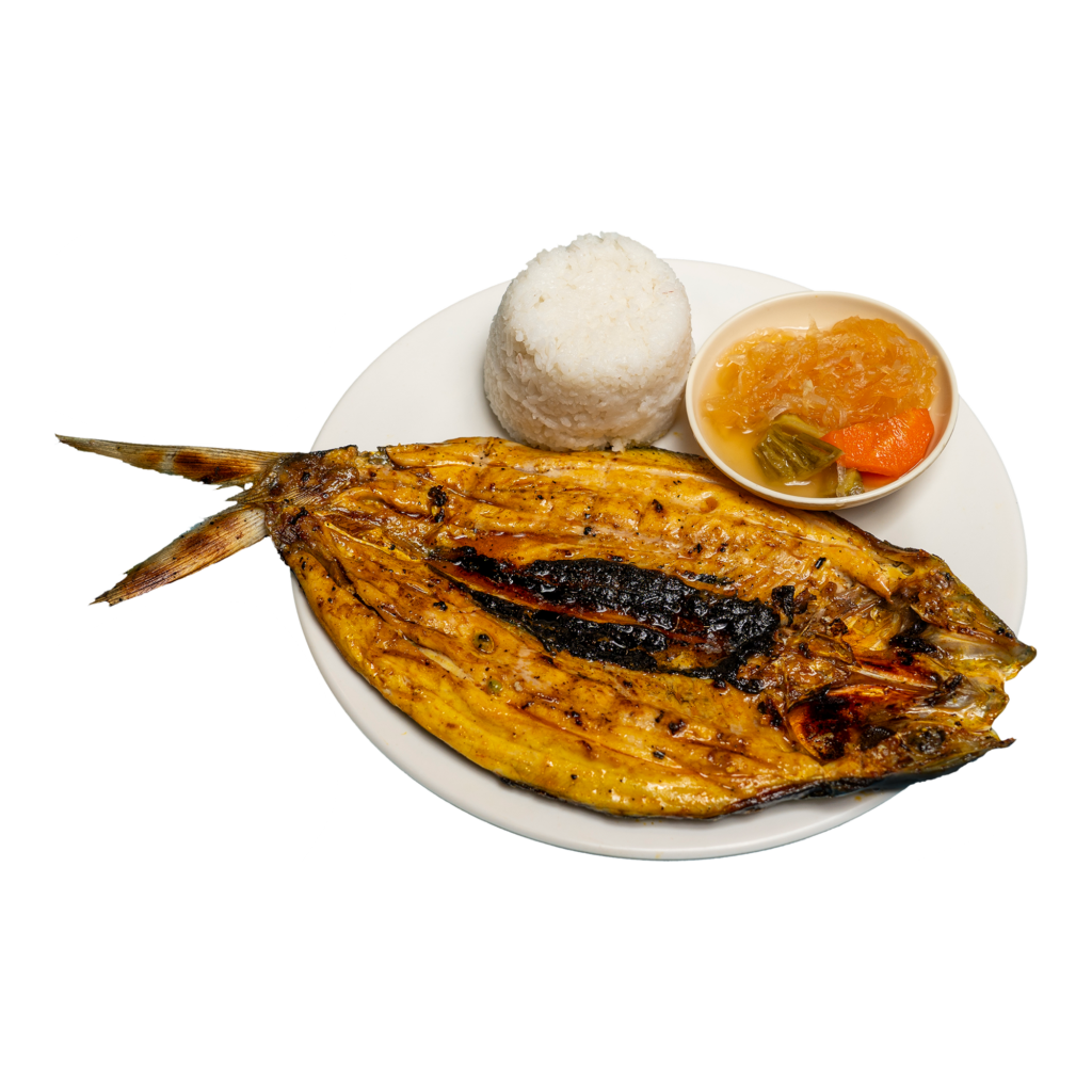 Cooked bangus, atsara, and a cup of rice on a white plate.