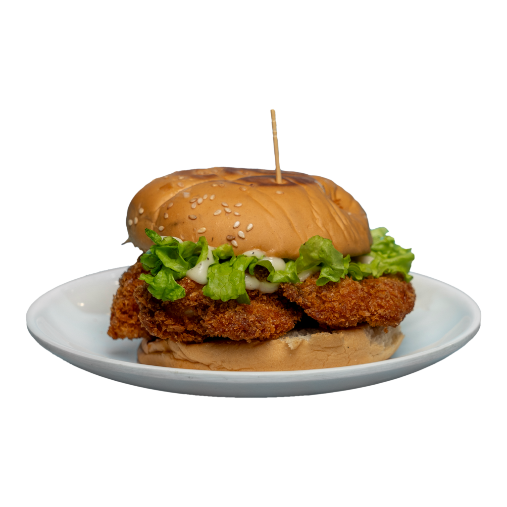 Chicken burger on a white plate.